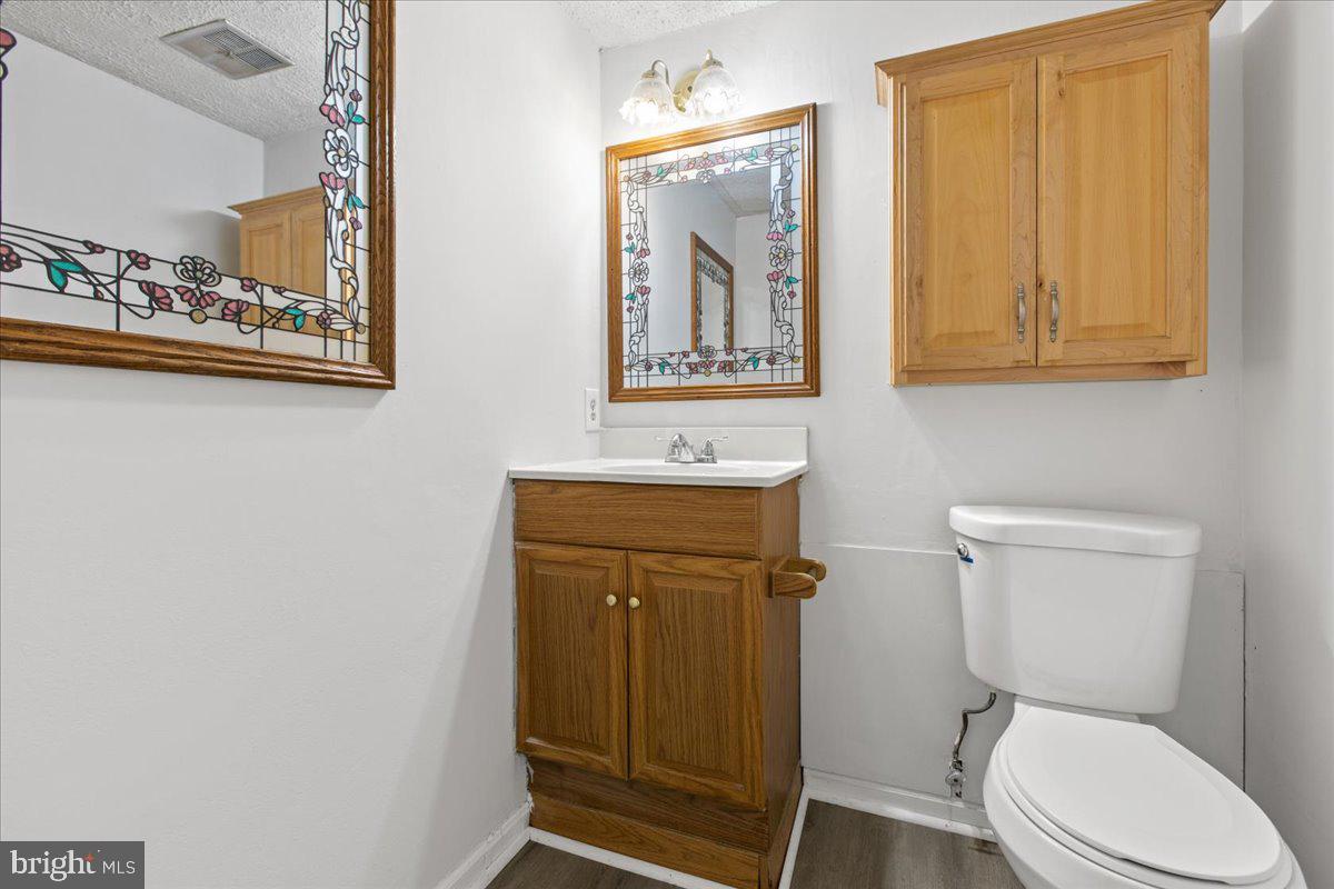 325 Londontown Road Edgewater, MD 21037 - Photo 29 of 34 a bathroom with a toilet a sink and mirror