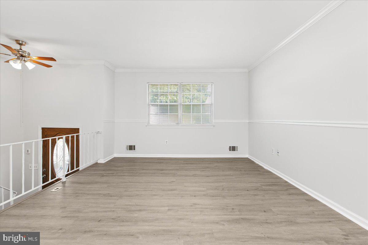 325 Londontown Road Edgewater, MD 21037 - Photo 10 of 34 a view of an empty room with wooden floor and a window