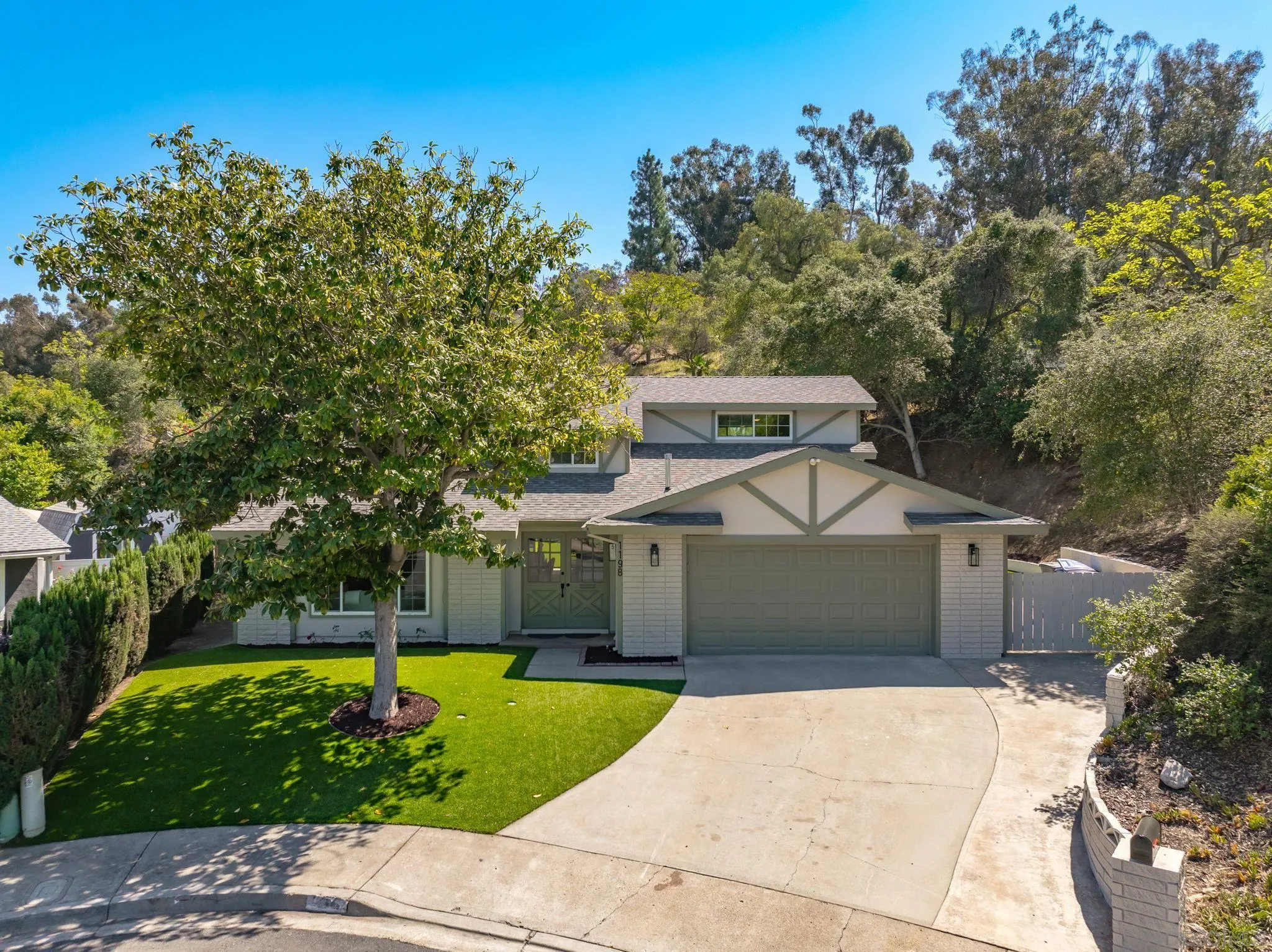 1198 Benjamin Place El Cajon, CA 92020 - Photo 1 of 38 a front view of a house with a yard