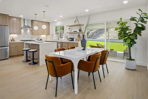 a kitchen with a table and chairs in it
