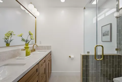a bathroom with a sink a vanity and a mirror