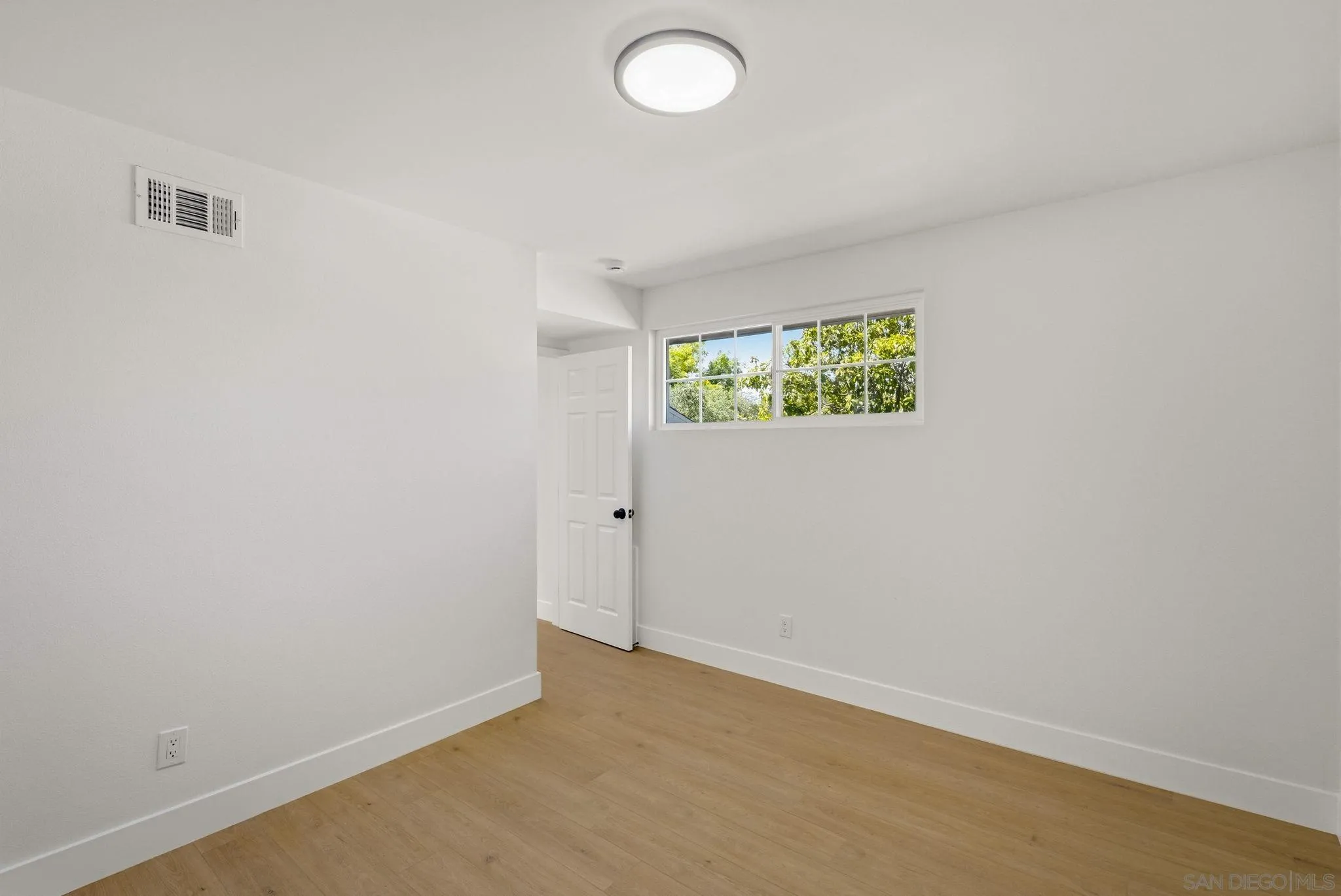 1198 Benjamin Place El Cajon, CA 92020 - Photo 24 of 38 an empty room with windows and closet
