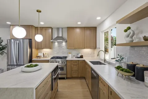 a kitchen with a sink stove and cabinets