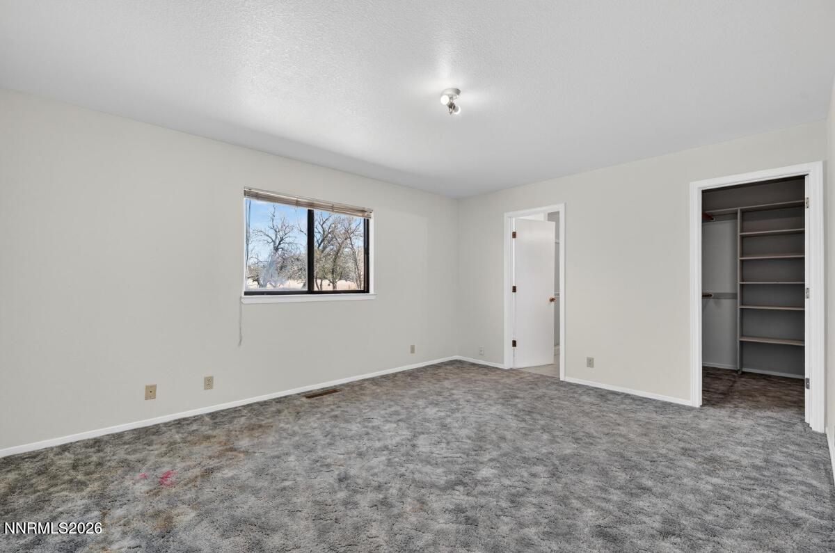 1254 Stephanie Way Minden, NV 89423 - Photo 15 of 30 a view of an empty room with a window