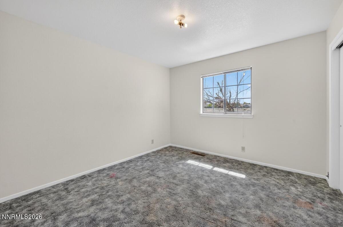 1254 Stephanie Way Minden, NV 89423 - Photo 20 of 30 an empty room with a empty space and window
