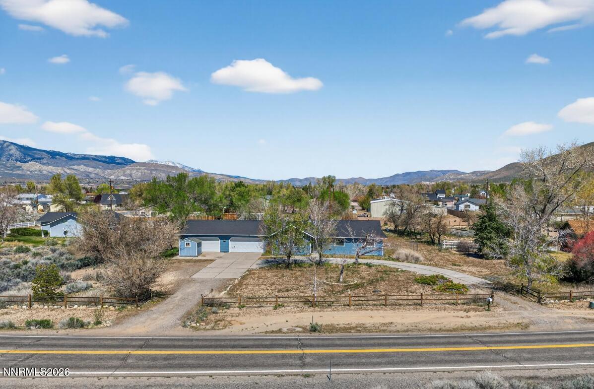 1254 Stephanie Way Minden, NV 89423 - Photo 2 of 30 a view of a terrace with a bench and mountain view