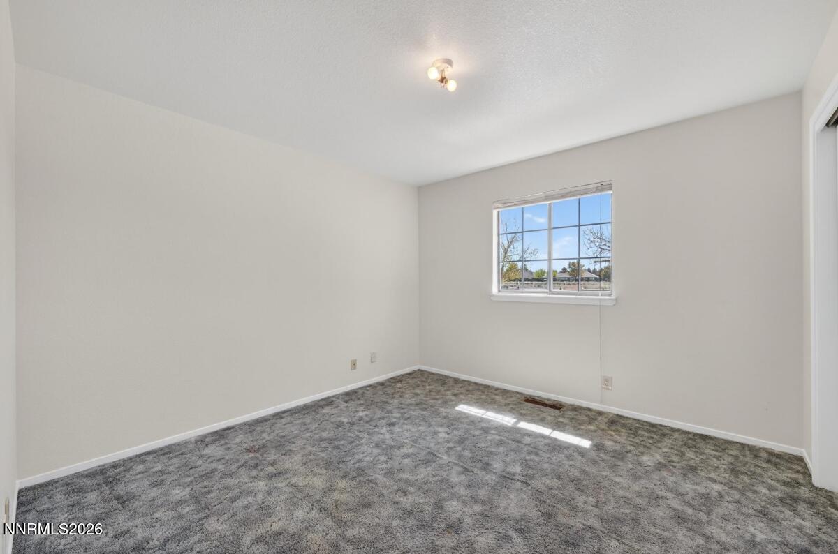 1254 Stephanie Way Minden, NV 89423 - Photo 22 of 30 an empty room with a empty space and window