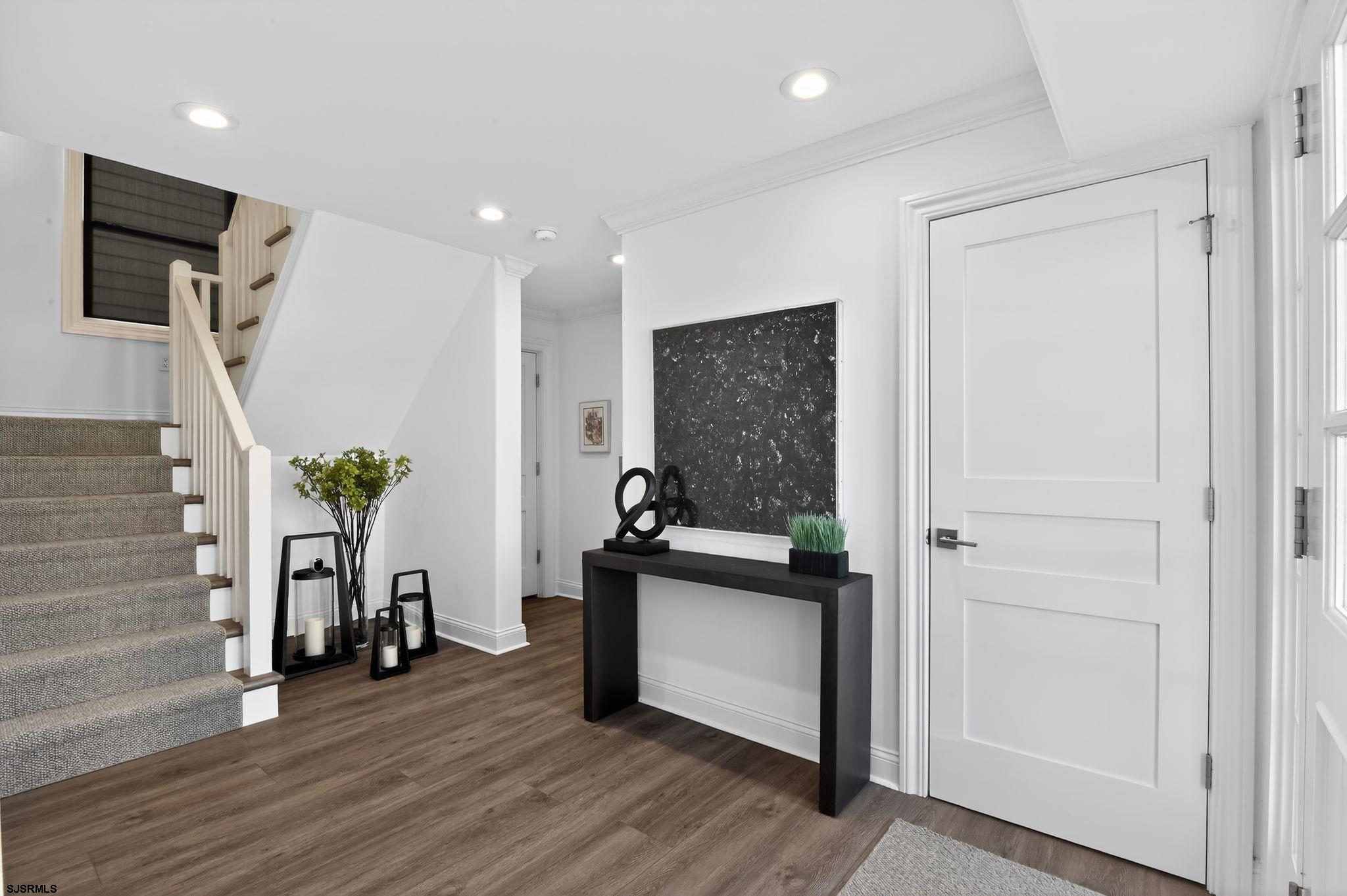 146 Ridgeway Avenue Atlantic City, NJ 08401 - Photo 17 of 59 a view of a hallway with wooden floor and windows