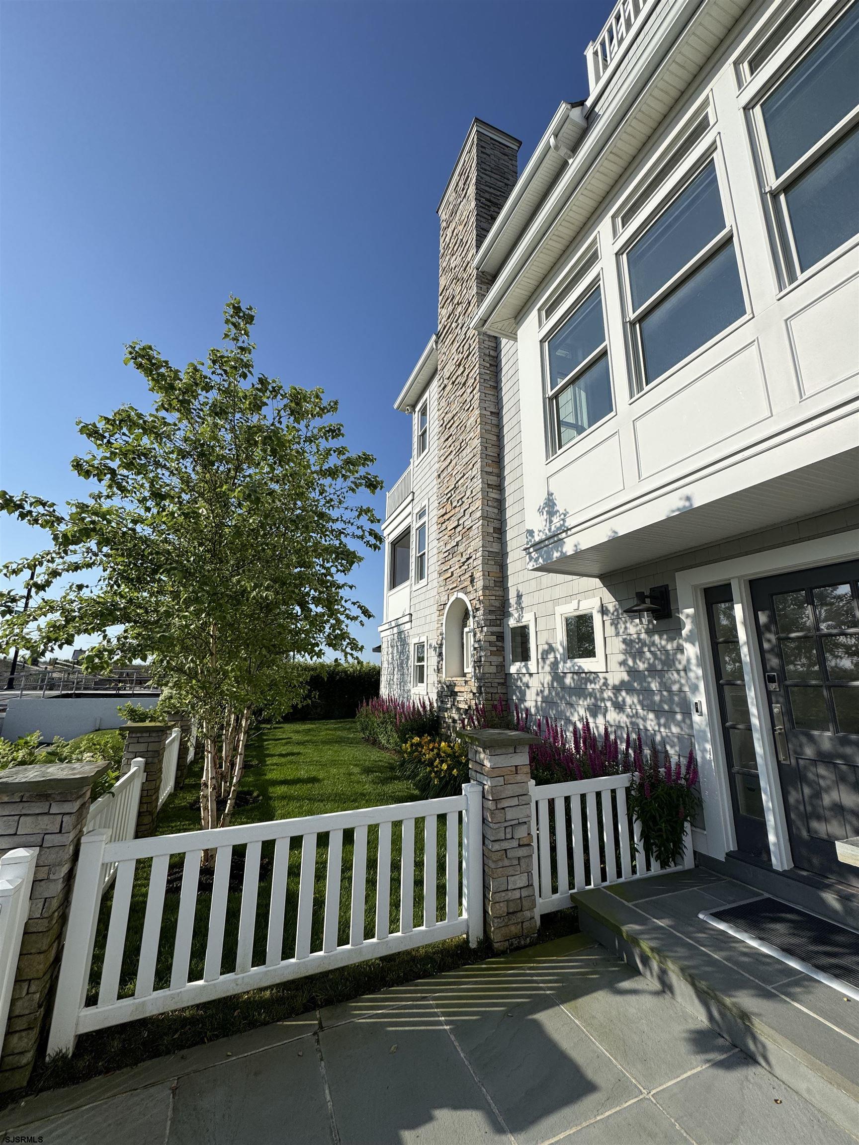 146 Ridgeway Avenue Atlantic City, NJ 08401 - Photo 19 of 59 a view of a brick house with entryway and wooden floor