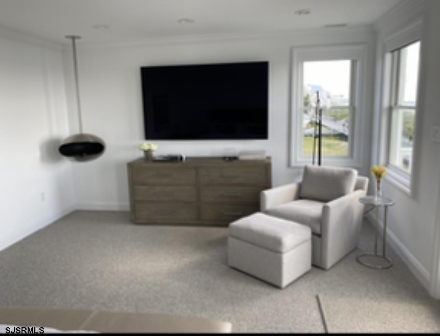 146 Ridgeway Avenue Atlantic City, NJ 08401 - Photo 22 of 59 a living room with furniture and a flat screen tv