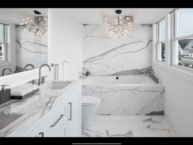 146 Ridgeway Avenue Atlantic City, NJ 08401 - Photo 23 of 59 a bathroom with a sink vanity and bathtub