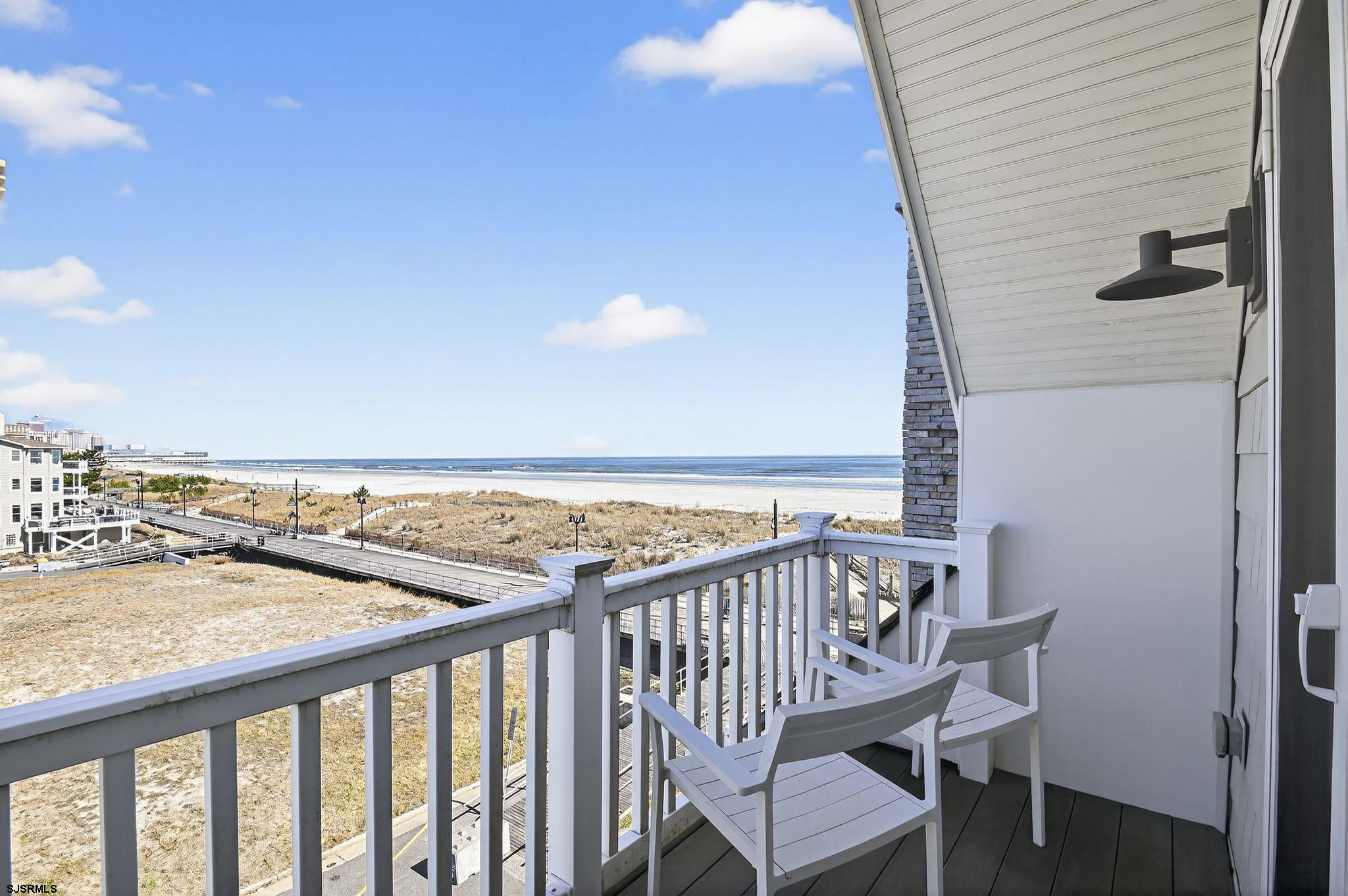 146 Ridgeway Avenue Atlantic City, NJ 08401 - Photo 25 of 59 a view of a balcony with wooden floor and seating space