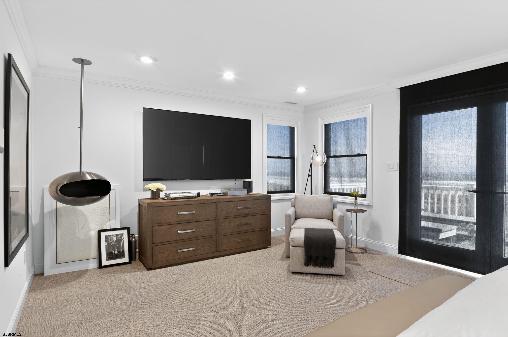 146 Ridgeway Avenue Atlantic City, NJ 08401 - Photo 26 of 59 a living room with furniture and a flat screen tv