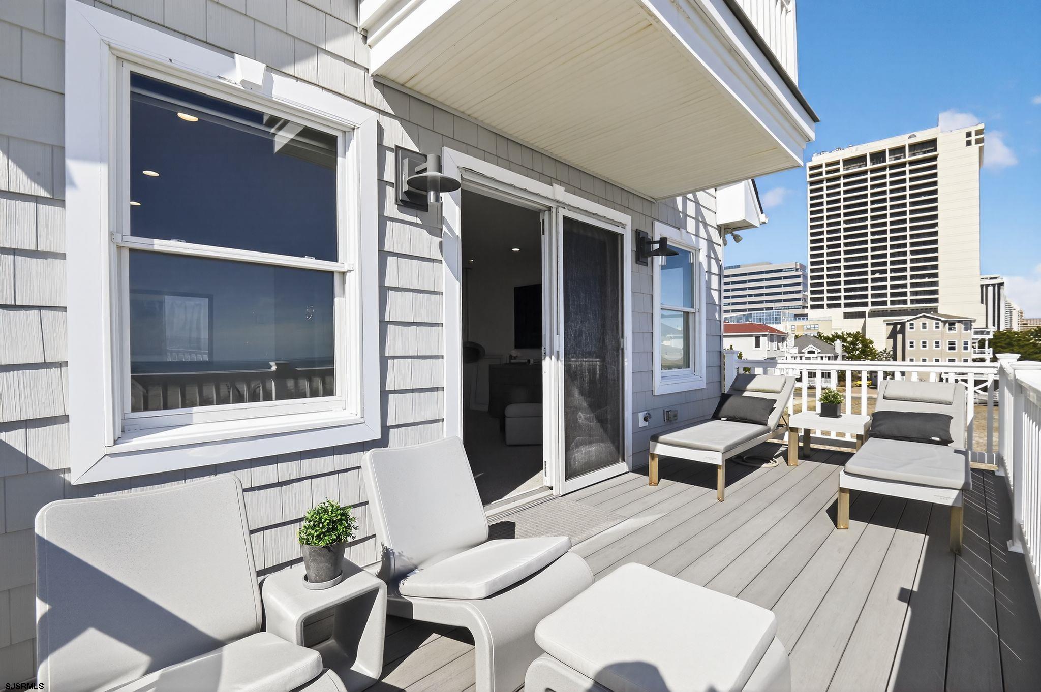 146 Ridgeway Avenue Atlantic City, NJ 08401 - Photo 30 of 59 a balcony with furniture and wooden floor