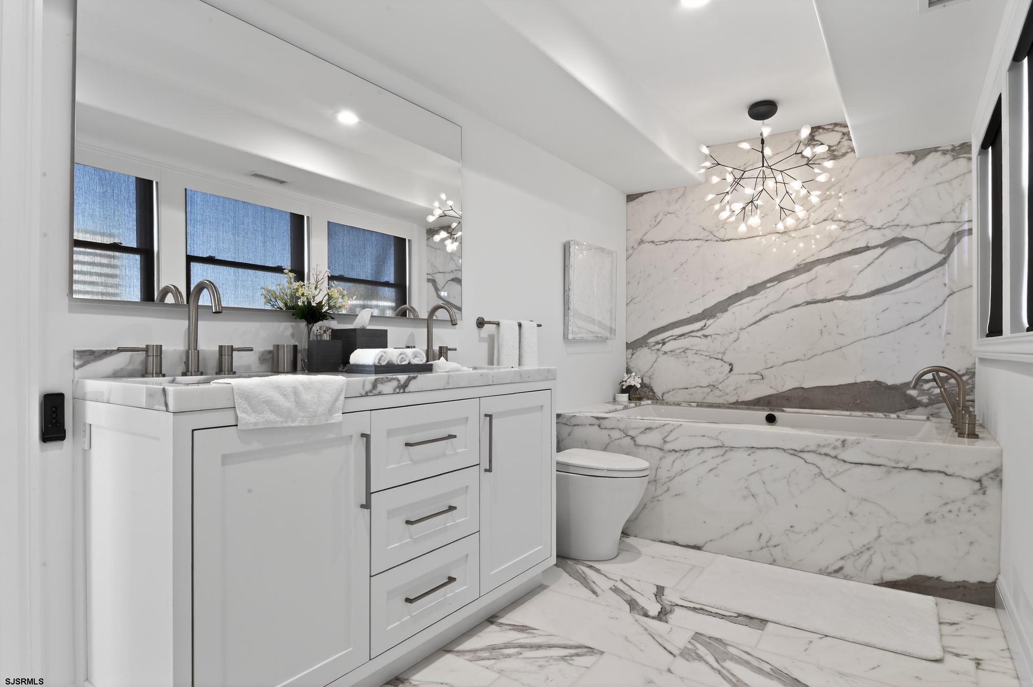 146 Ridgeway Avenue Atlantic City, NJ 08401 - Photo 35 of 59 a kitchen with cabinets appliances a sink and a window