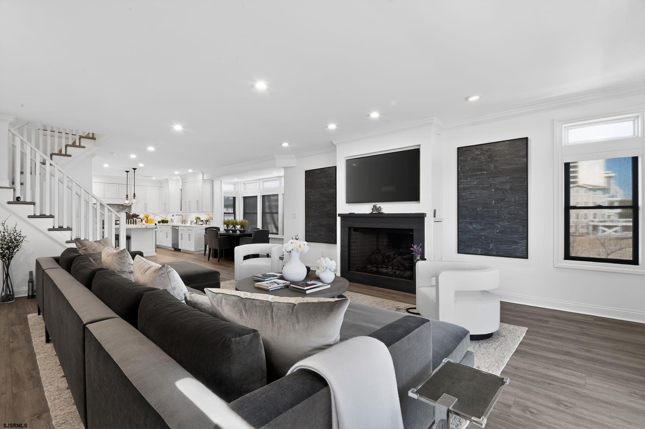 146 Ridgeway Avenue Atlantic City, NJ 08401 - Photo 6 of 59 a living room with fireplace furniture and a wooden floor