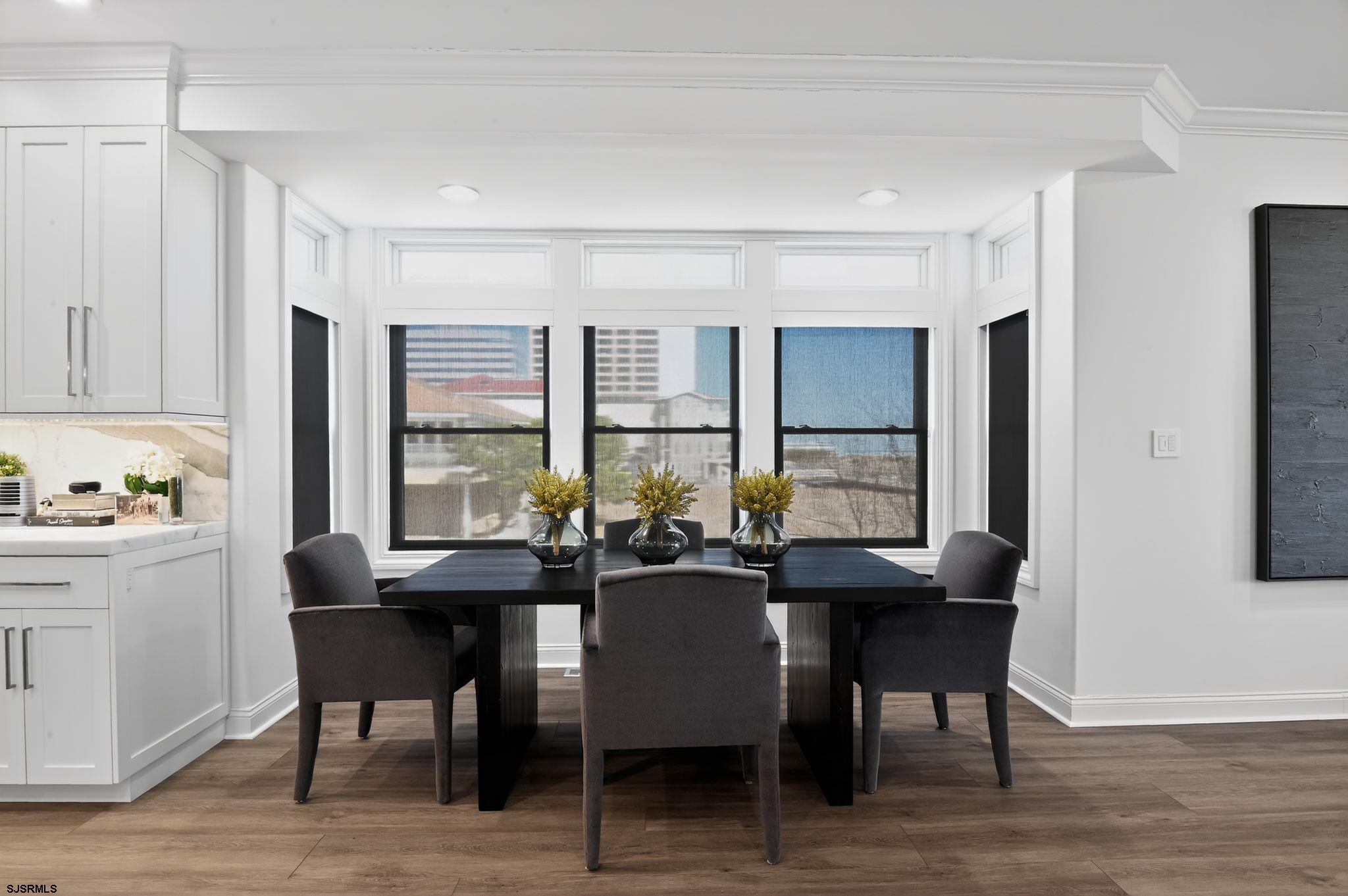 146 Ridgeway Avenue Atlantic City, NJ 08401 - Photo 8 of 59 a view of a dining room with furniture window and wooden floor