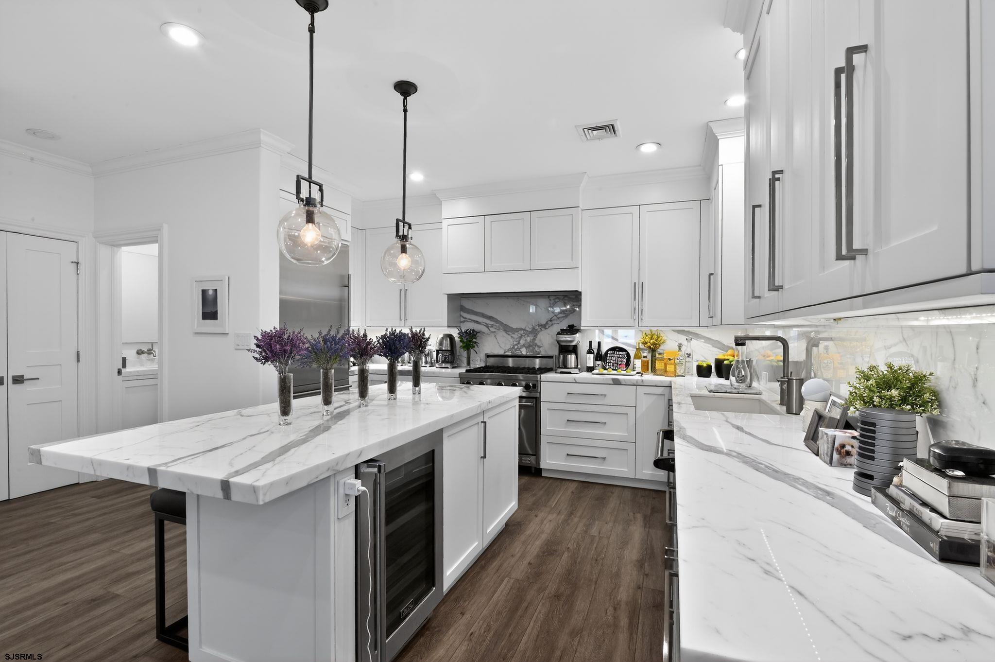 146 Ridgeway Avenue Atlantic City, NJ 08401 - Photo 10 of 59 a kitchen with white cabinets stove and refrigerator