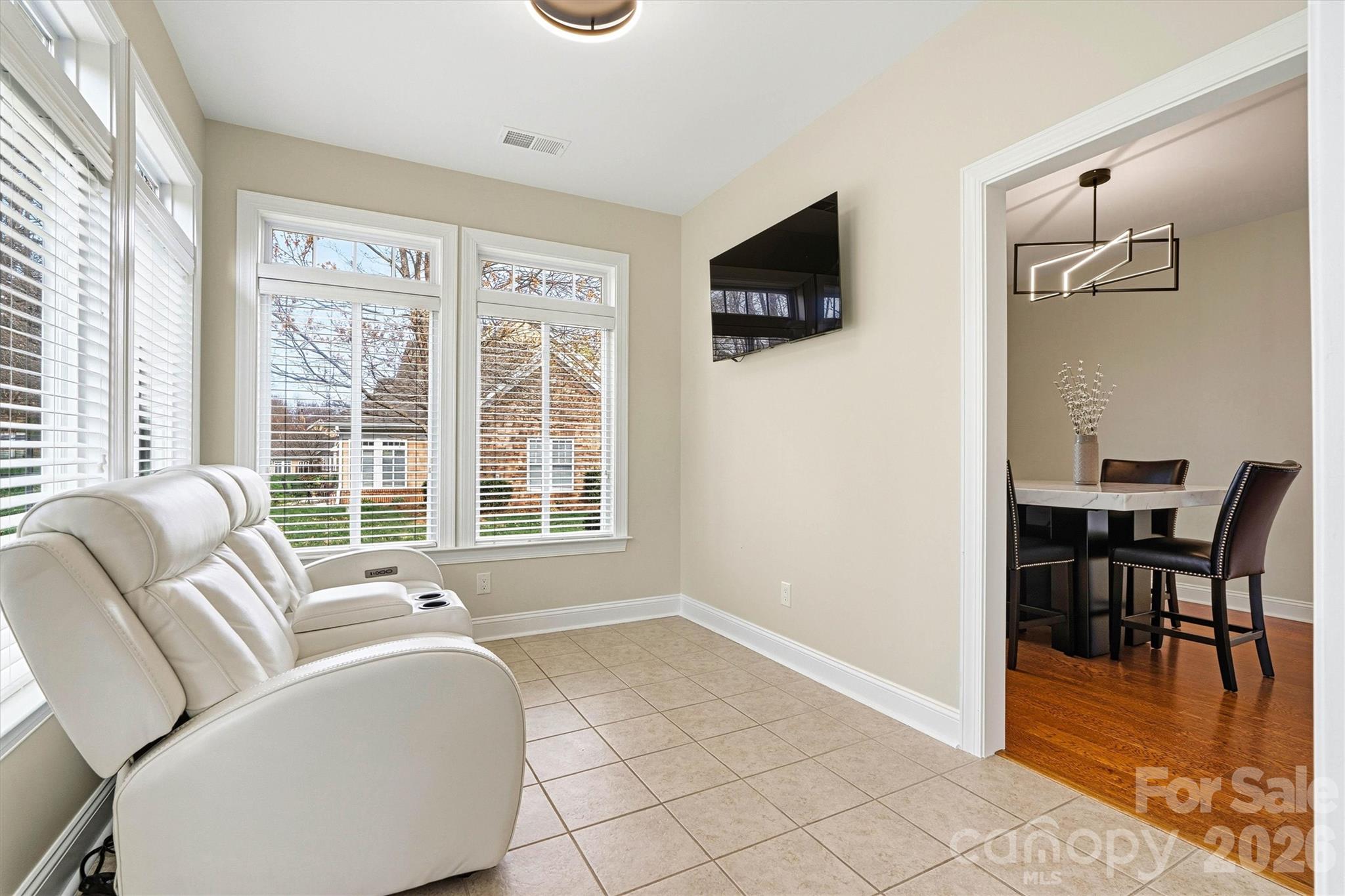 2830 Bellasera Way Matthews, NC 28105 - Photo 13 of 40 a living room with furniture and a flat screen tv
