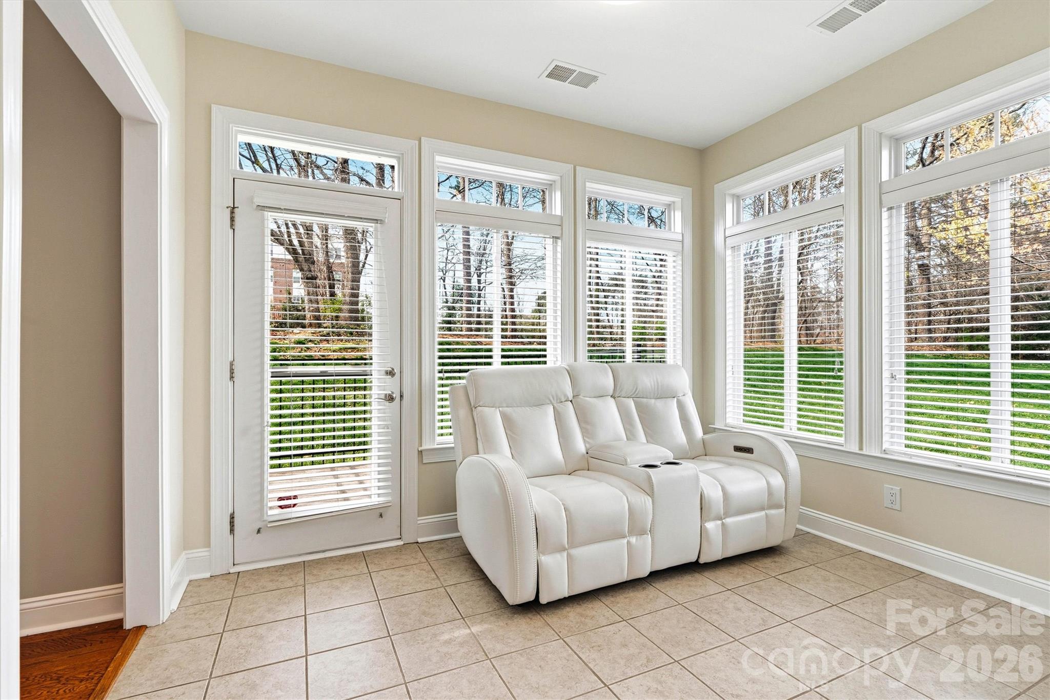 2830 Bellasera Way Matthews, NC 28105 - Photo 14 of 40 a living room with furniture and windows