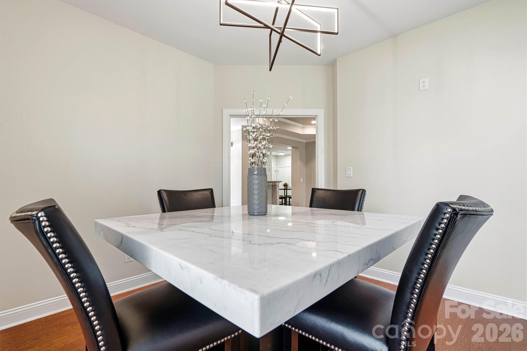 2830 Bellasera Way Matthews, NC 28105 - Photo 16 of 40 a view of a dining room with furniture