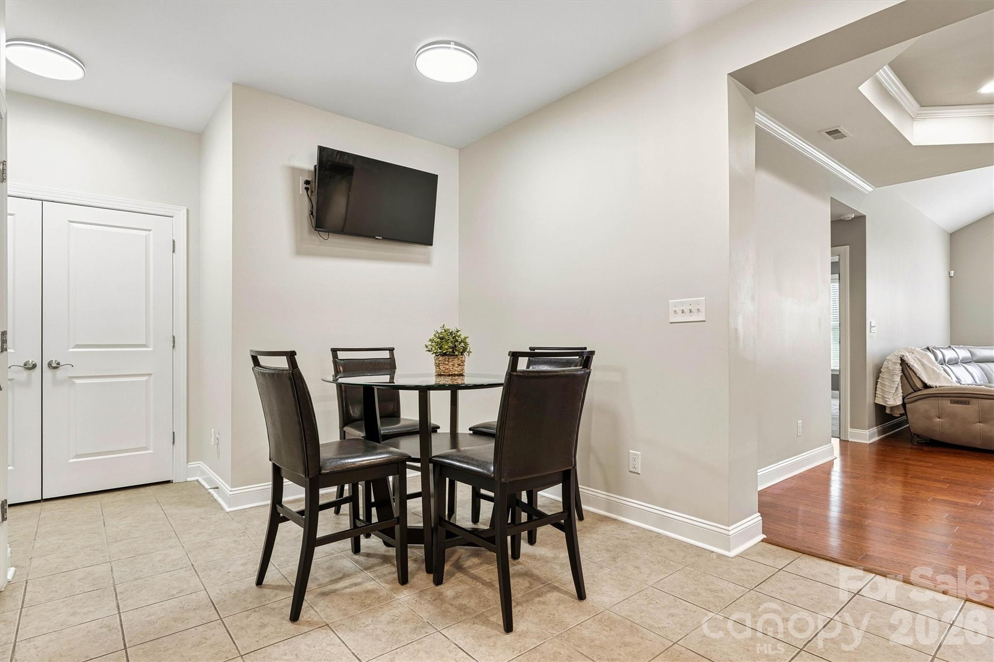 2830 Bellasera Way Matthews, NC 28105 - Photo 18 of 40 a view of a dining room with furniture and wooden floor