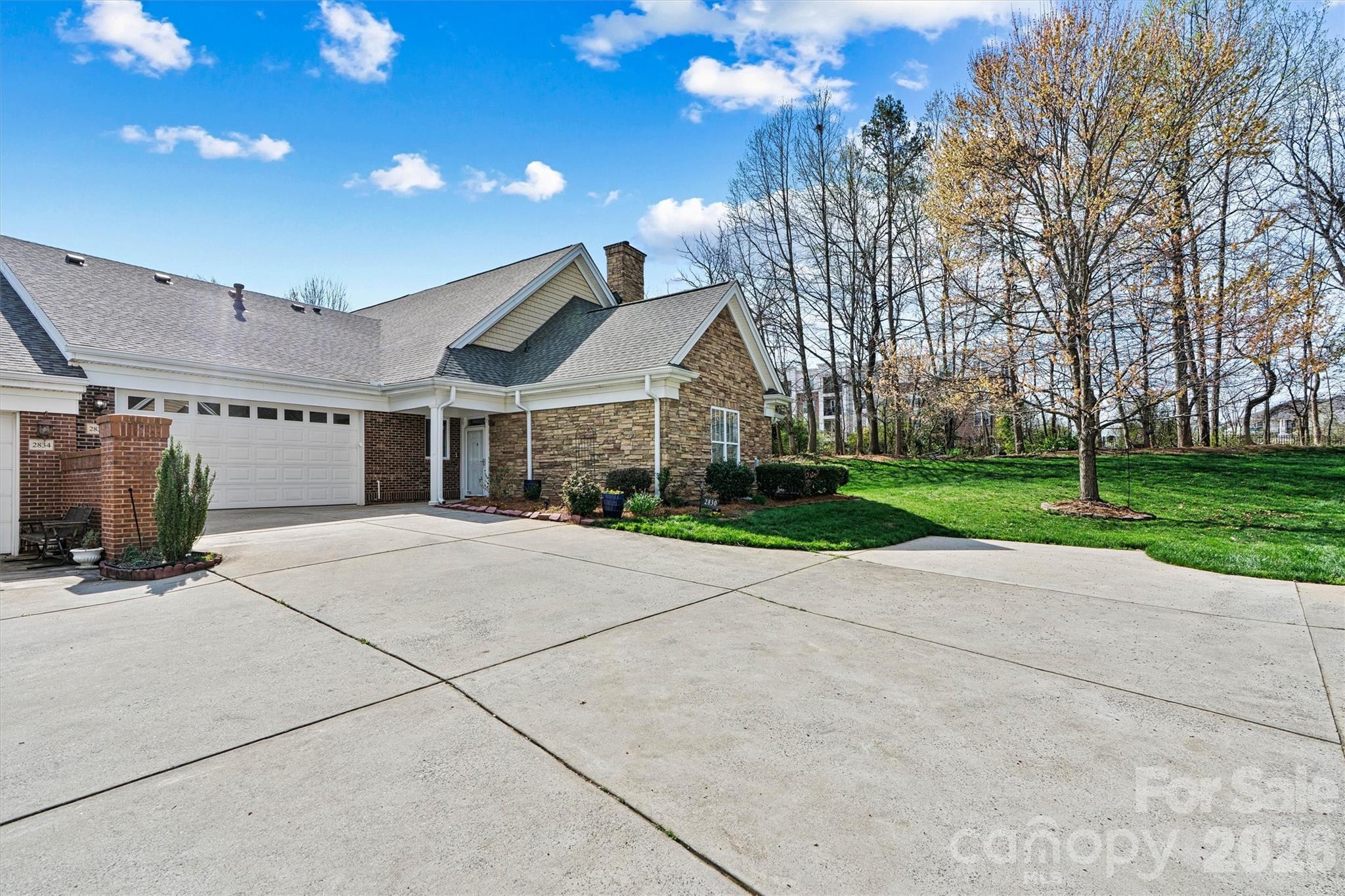 2830 Bellasera Way Matthews, NC 28105 - Photo 2 of 40 a view of a house with a yard and large tree