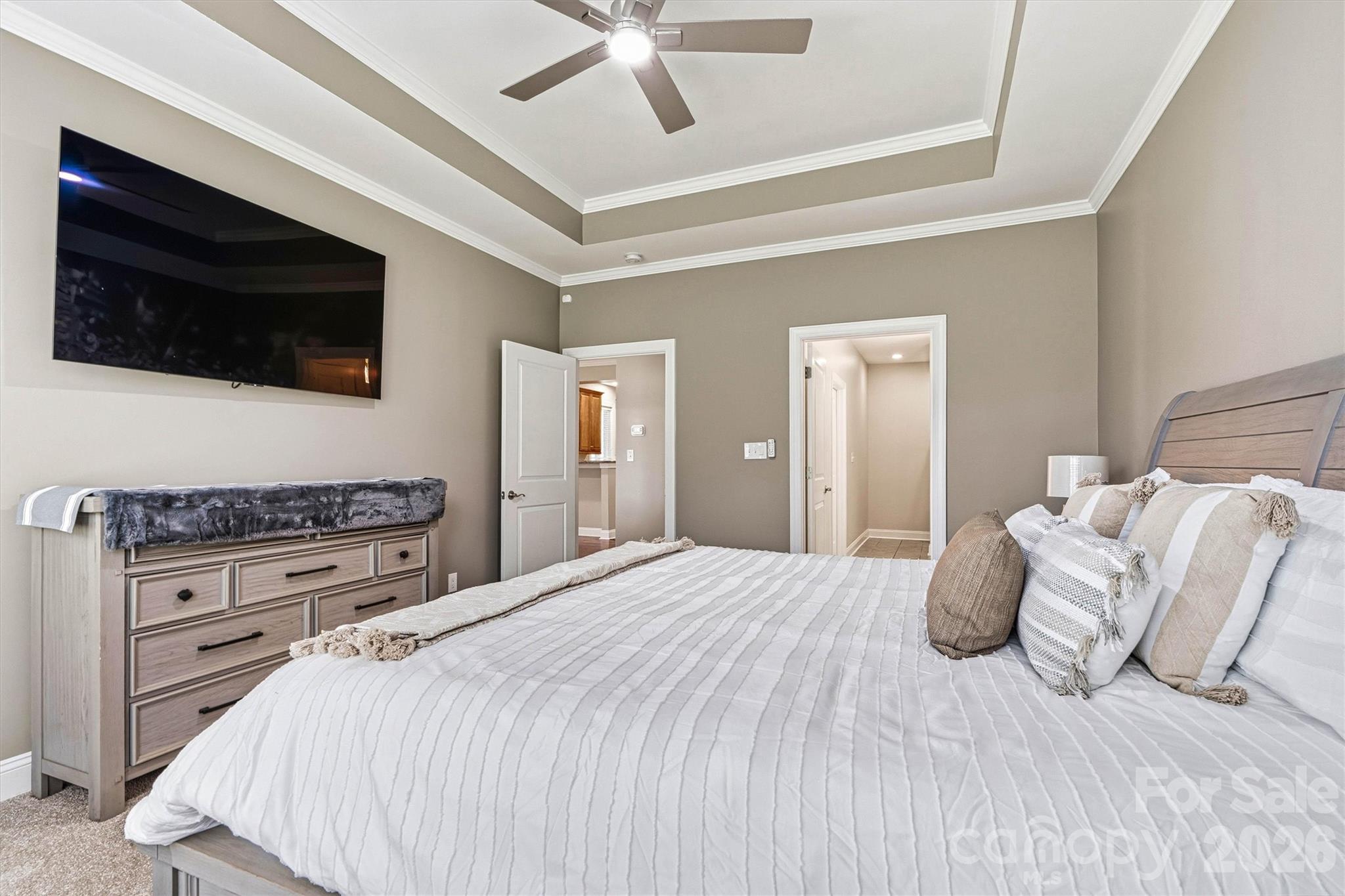 2830 Bellasera Way Matthews, NC 28105 - Photo 22 of 40 a bedroom with a bed and a flat screen tv