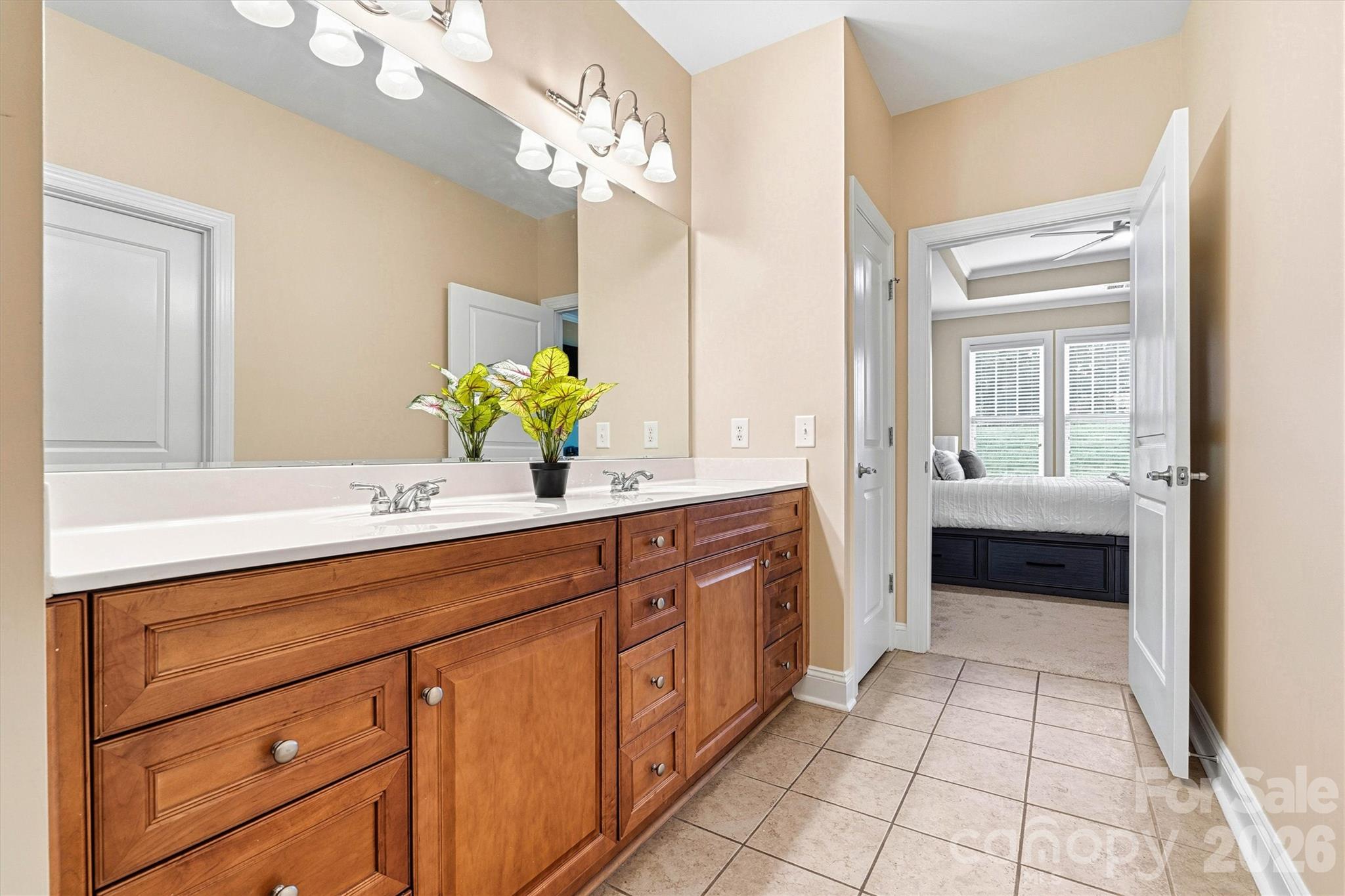 2830 Bellasera Way Matthews, NC 28105 - Photo 25 of 40 a spacious en suite bathroom with a double vanity sink and a mirror