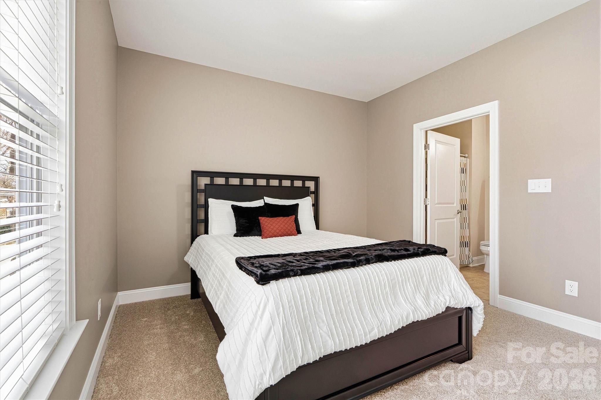 2830 Bellasera Way Matthews, NC 28105 - Photo 27 of 40 a bedroom with a bed and window