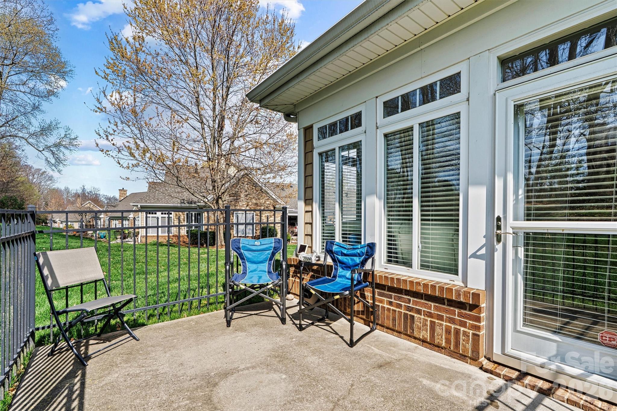 2830 Bellasera Way Matthews, NC 28105 - Photo 30 of 40 a view of a chair and table in the back yard of the house