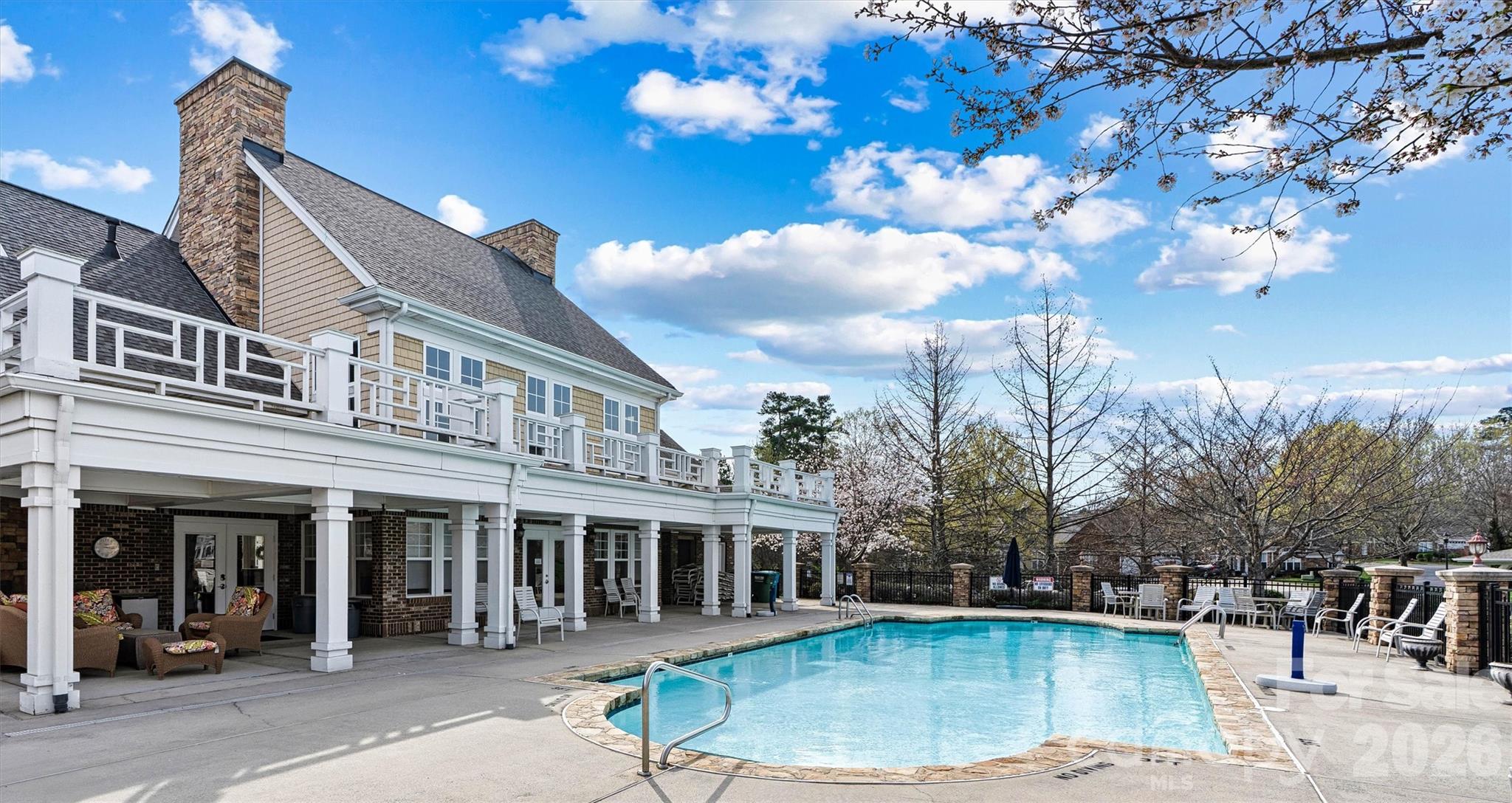 2830 Bellasera Way Matthews, NC 28105 - Photo 34 of 40 a view of a white building with a fountain in front of house