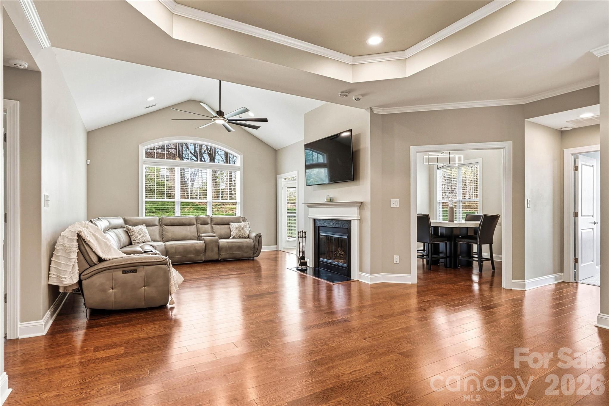 2830 Bellasera Way Matthews, NC 28105 - Photo 6 of 40 a living room with furniture fireplace and a flat screen tv