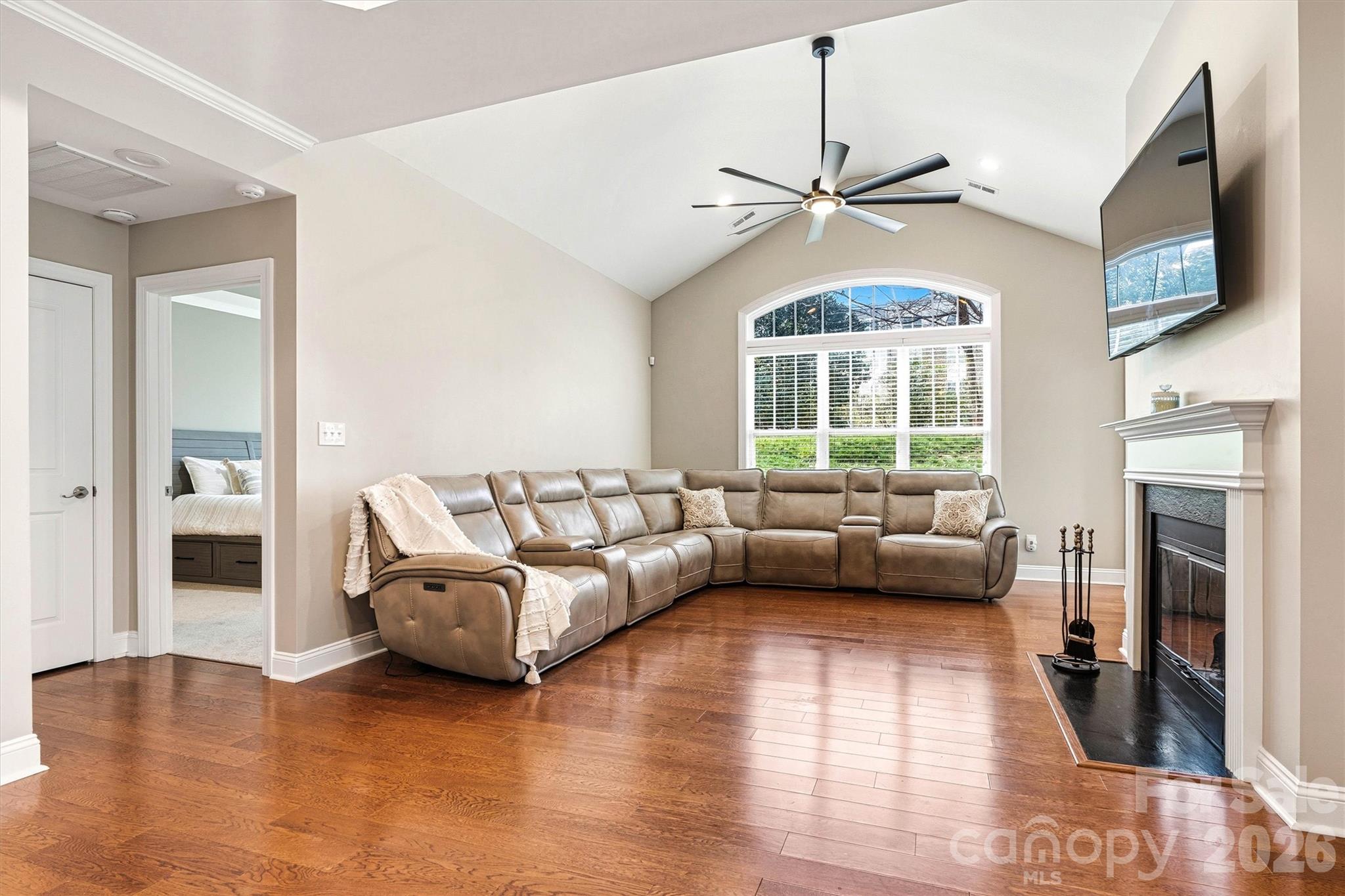 2830 Bellasera Way Matthews, NC 28105 - Photo 9 of 40 a living room with furniture and a fireplace
