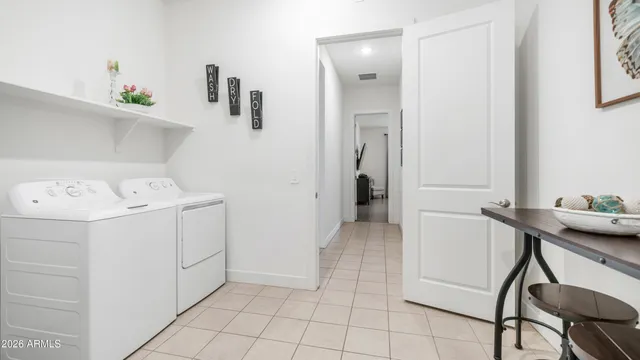 a utility room with dryer and washer