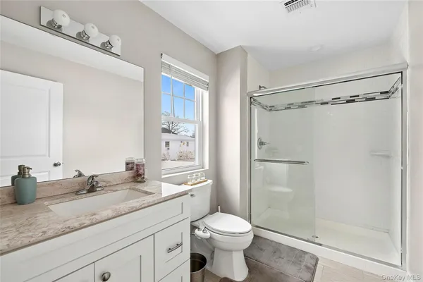 a very nice looking bedroom with a bed and a book shelf