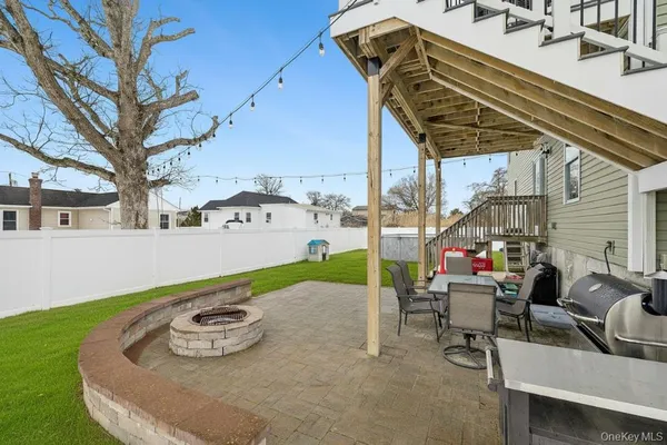 a view of a chairs and table in the patio