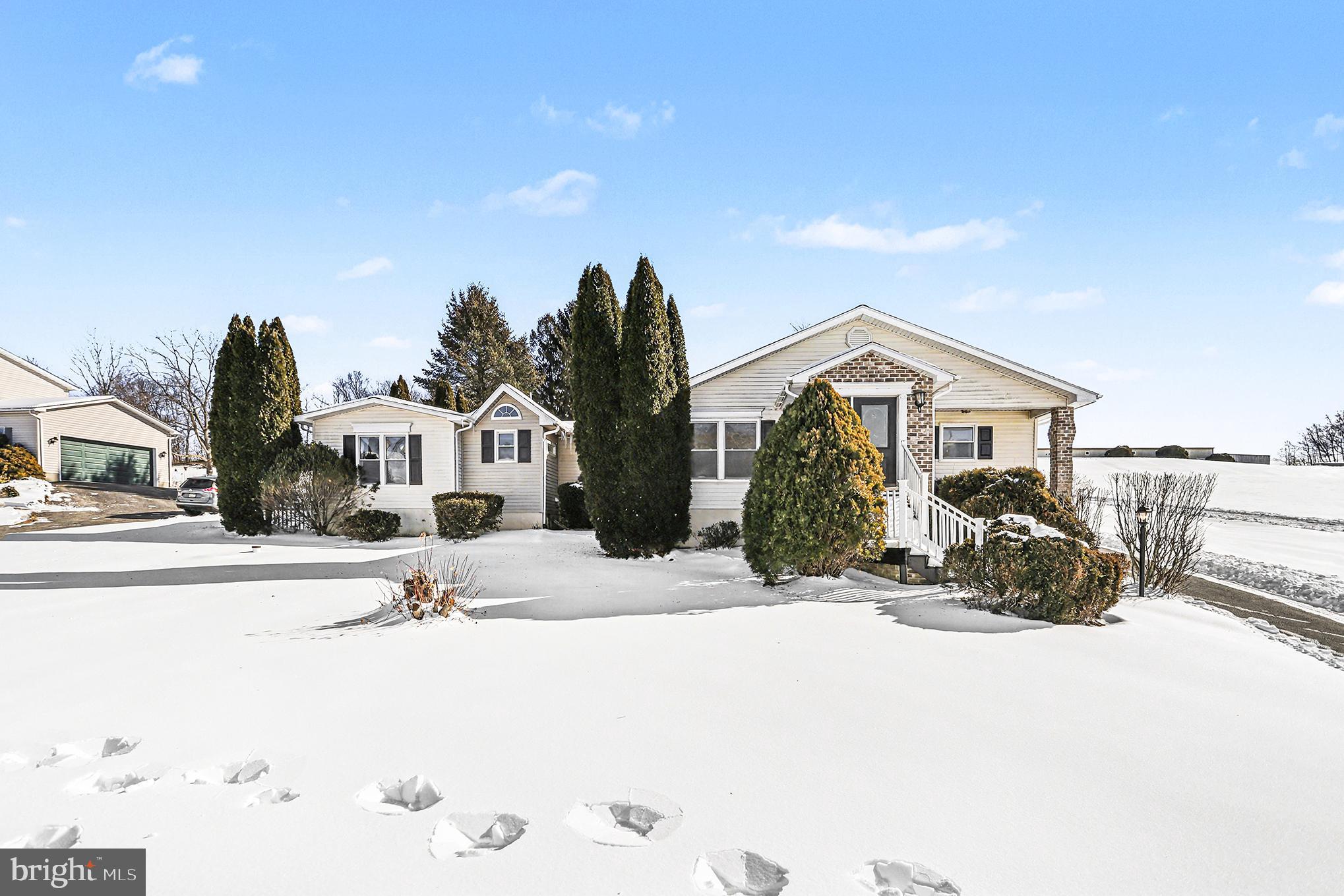 Charming home nestled in a winter wonderland.