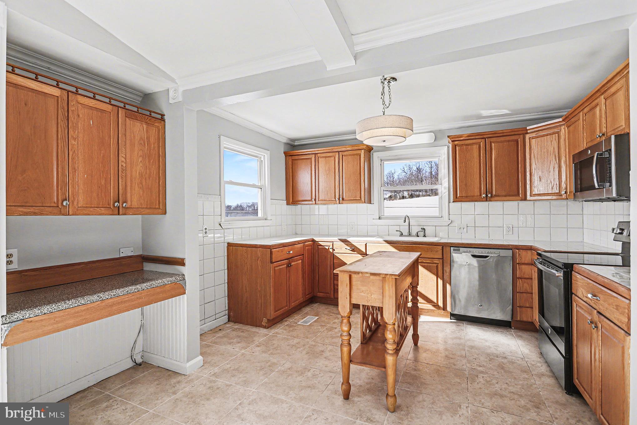 4570 Walters Hatchery Road Spring Grove, PA 17362 - Photo 13 of 38 Warm wooden kitchen cabinets and accents.