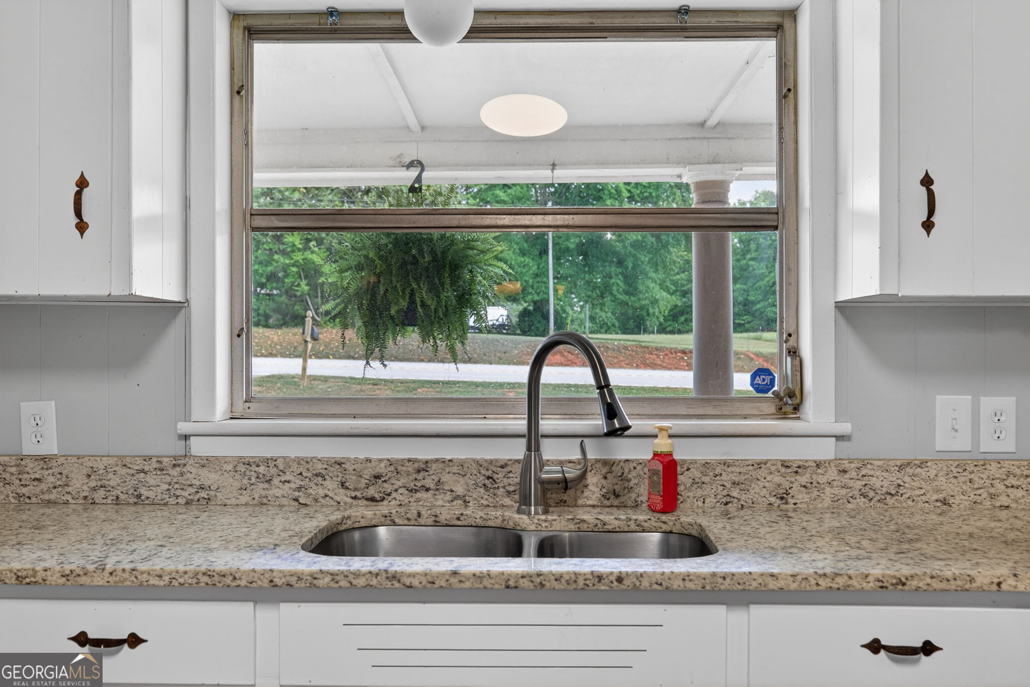 1861 Highway 100 Bowdon, GA 30108 - Photo 14 of 35 a kitchen sink with a granite countertop window and sink