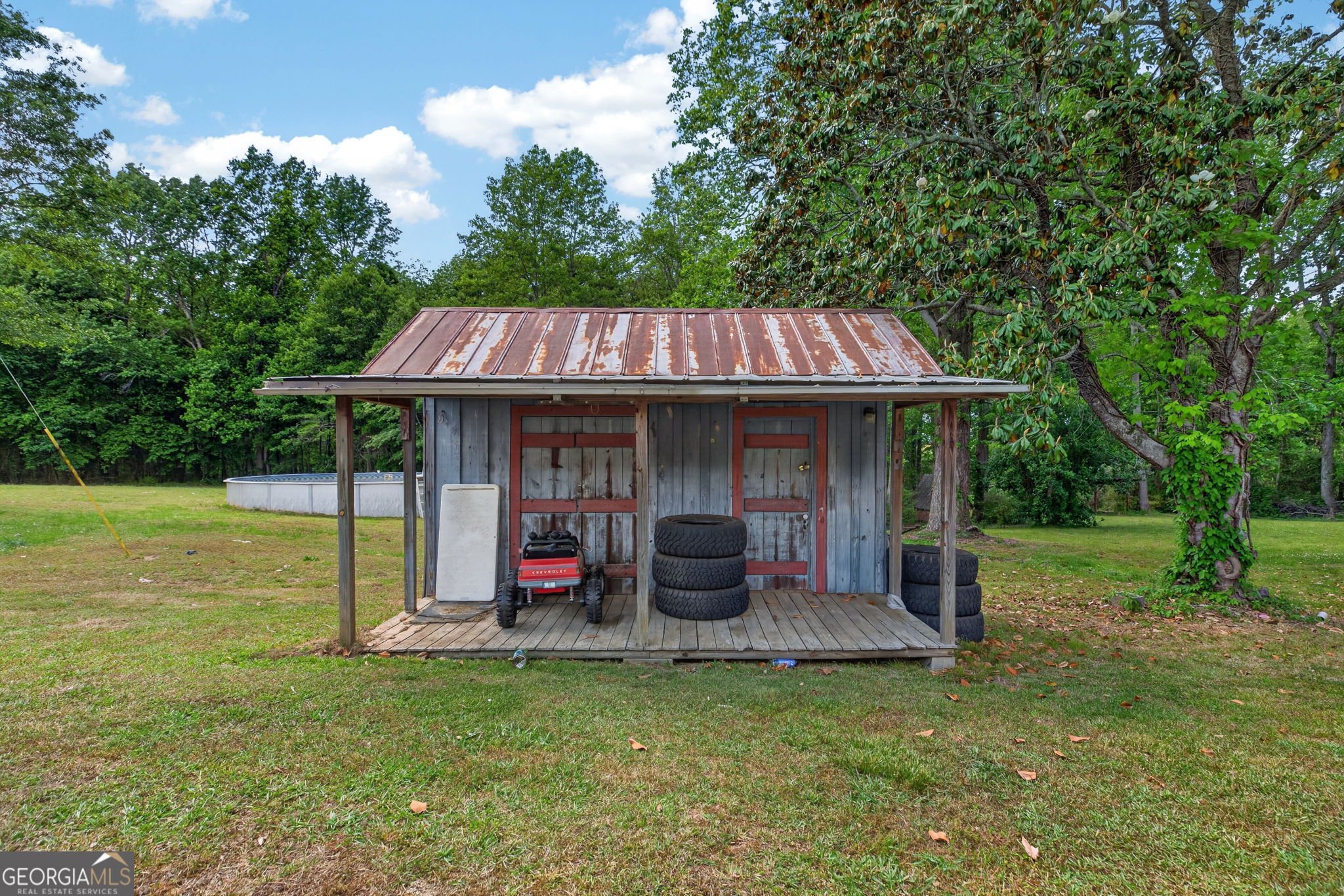1861 Highway 100 Bowdon, GA 30108 - Photo 28 of 35 a view of a chair and table in the garden