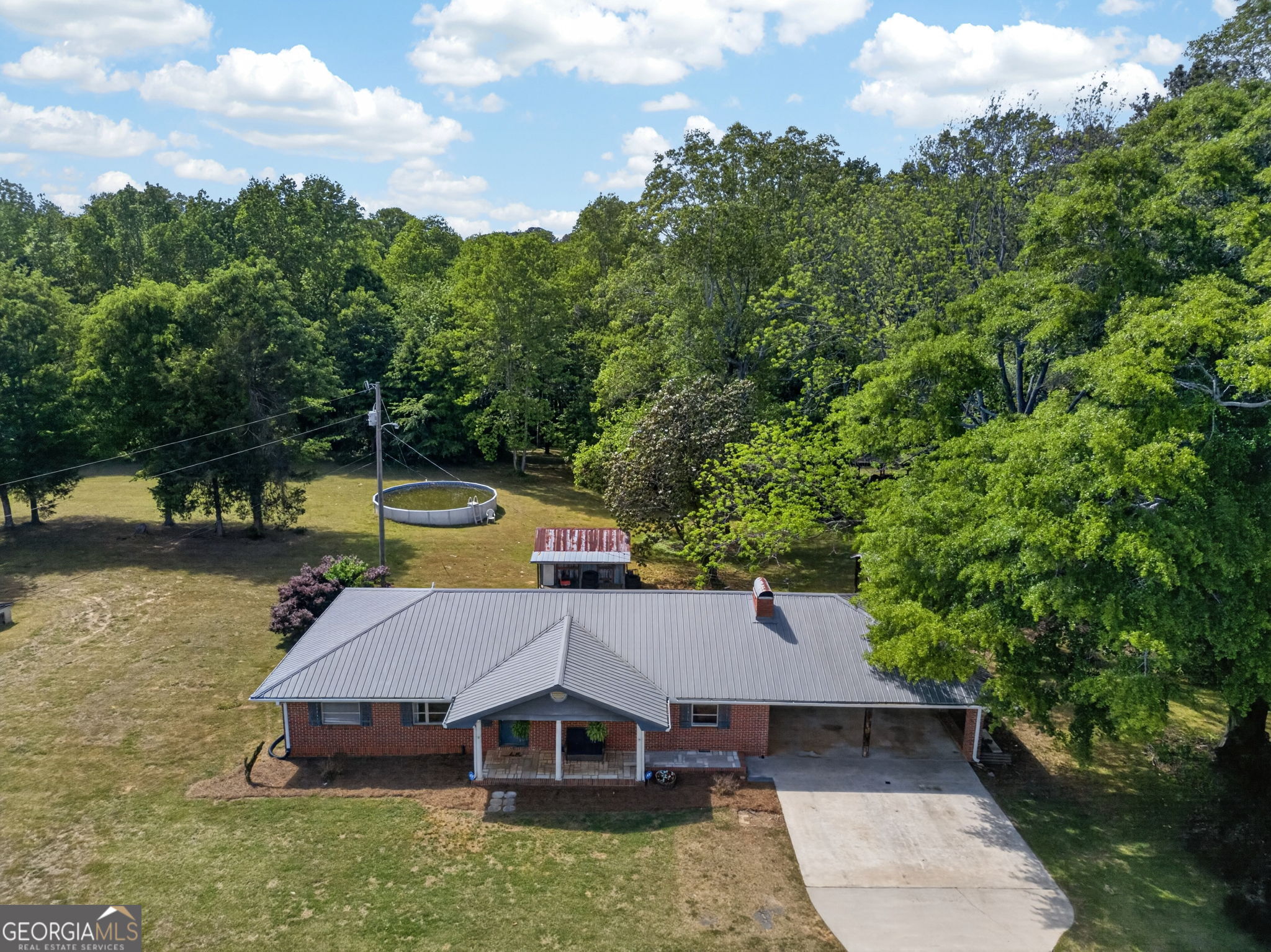 1861 Highway 100 Bowdon, GA 30108 - Photo 5 of 35 an aerial view of a house with swimming pool and big yard