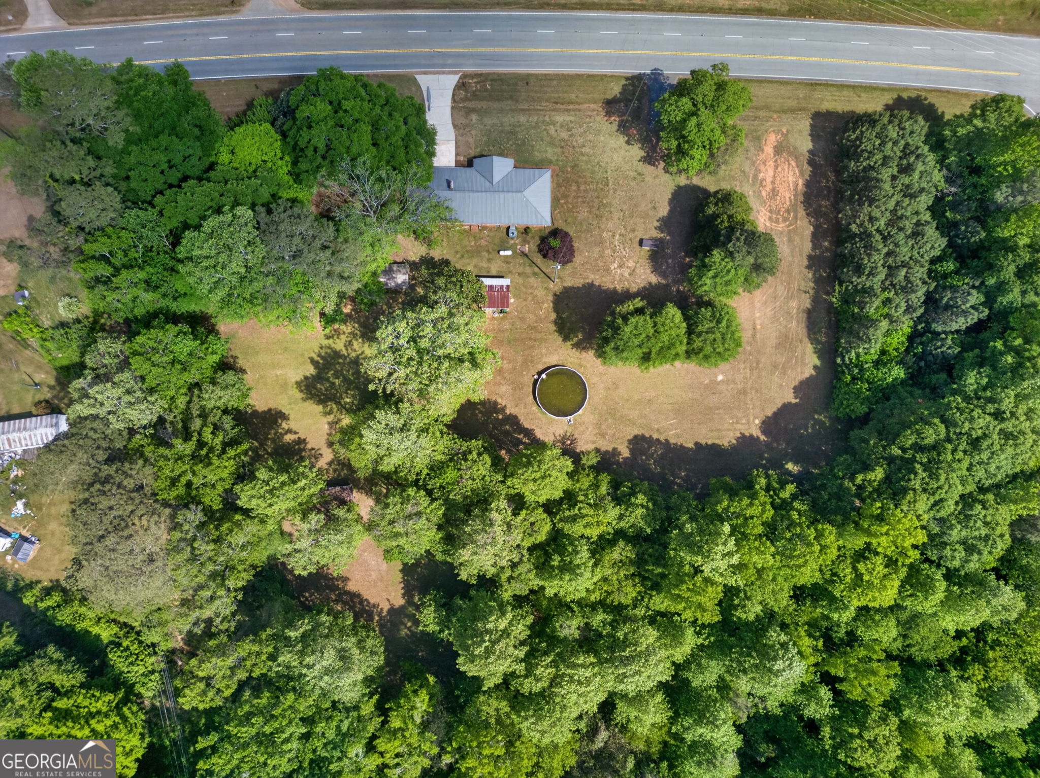 1861 Highway 100 Bowdon, GA 30108 - Photo 8 of 35 an aerial view of a house with a yard