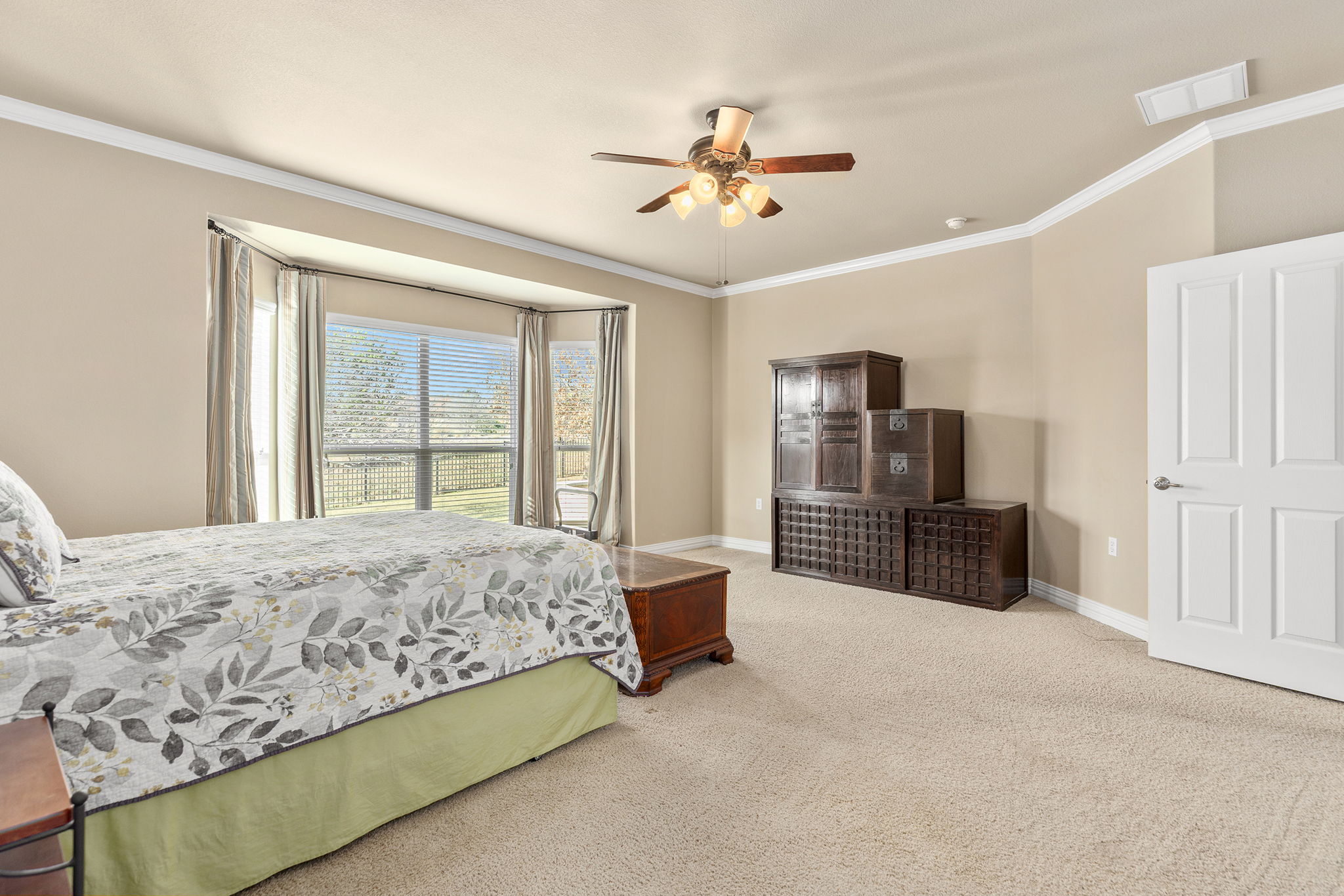 110 Emory Peak Trail Georgetown, TX 78633 - Photo 21 of 39 Bedroom featuring crown molding, carpet flooring, and a ceiling fan