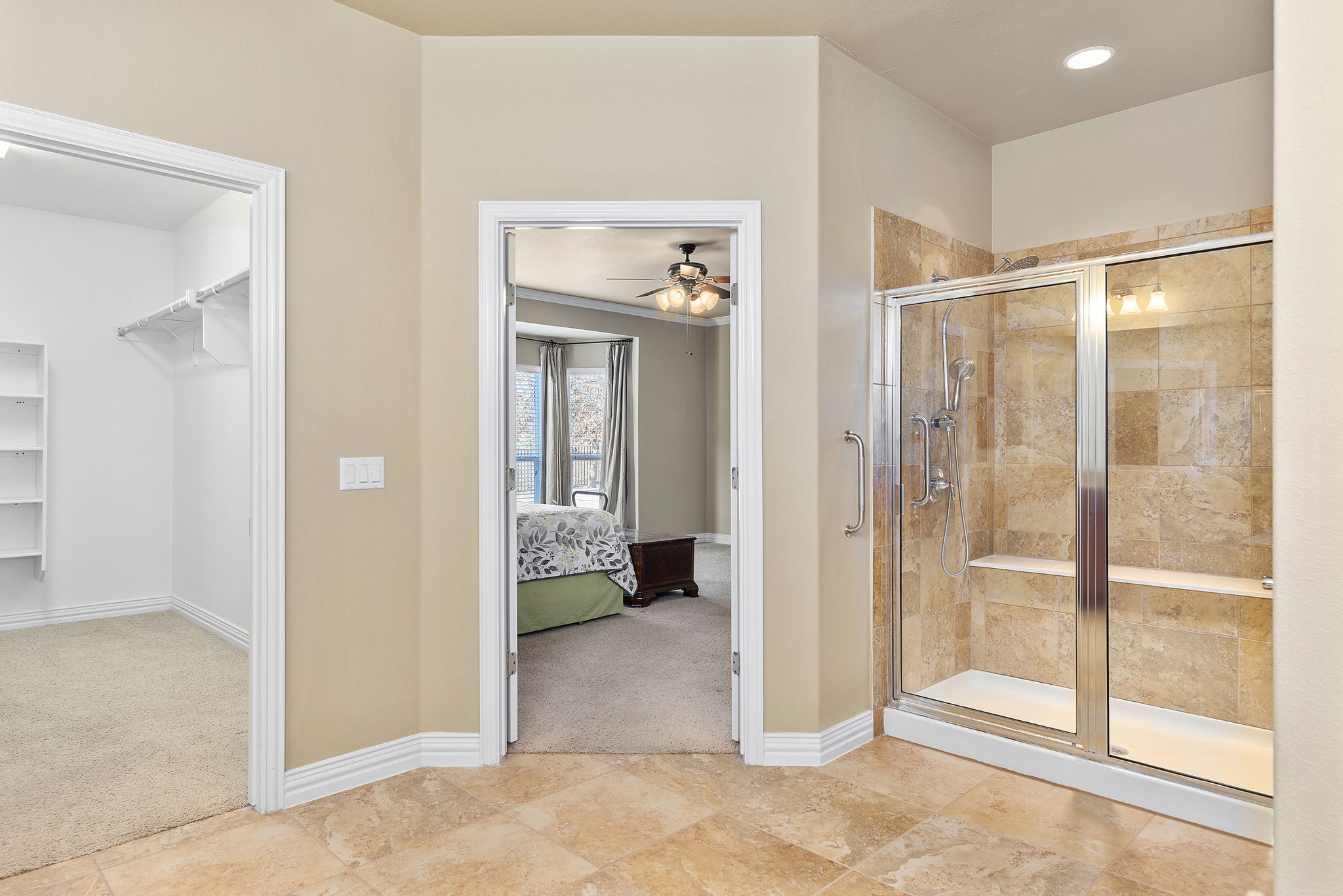110 Emory Peak Trail Georgetown, TX 78633 - Photo 24 of 39 Full bathroom with a spacious closet, light carpet, ensuite bathroom, and a stall shower