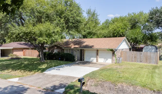 a backyard of a house with yard and outdoor seating