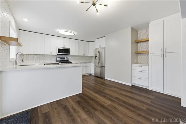 a view of kitchen with wooden floor and window