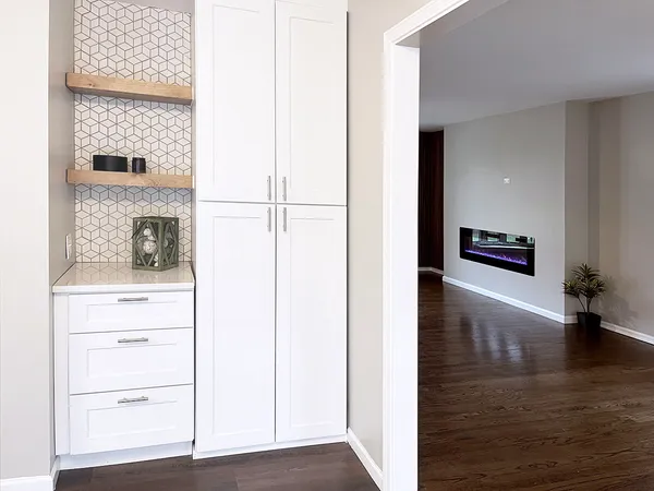 a kitchen with stainless steel appliances a refrigerator sink and microwave