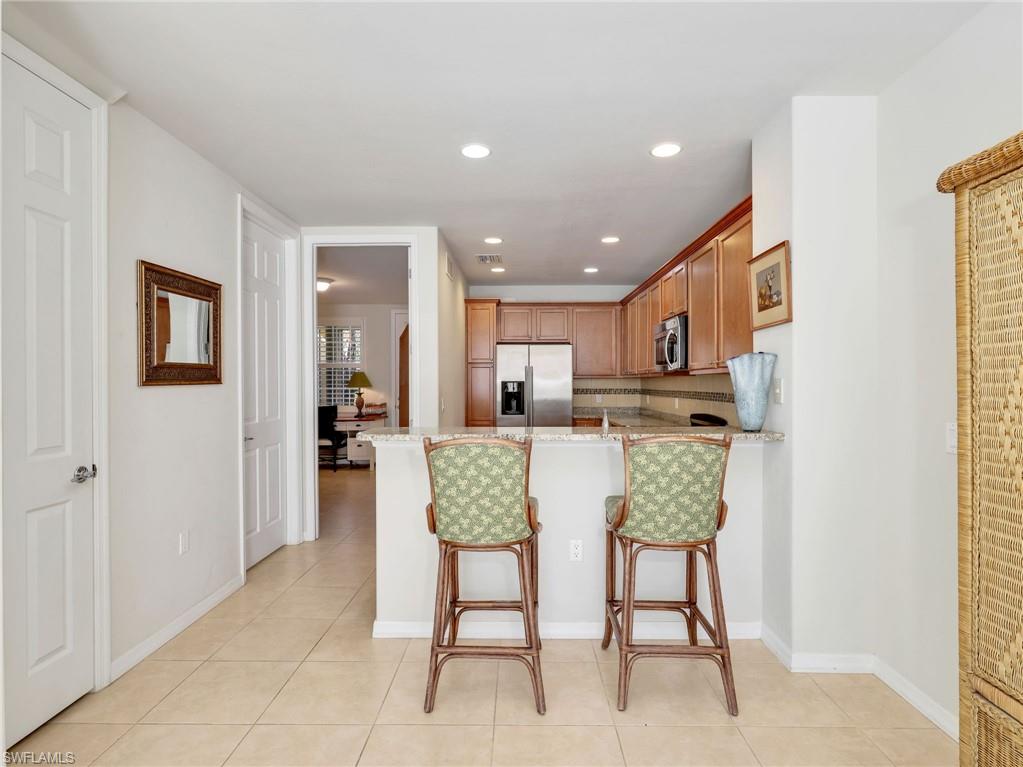 8192 Josefa Way Naples, FL 34114 - Photo 2 of 29 a view of kitchen with dining area and chandelier