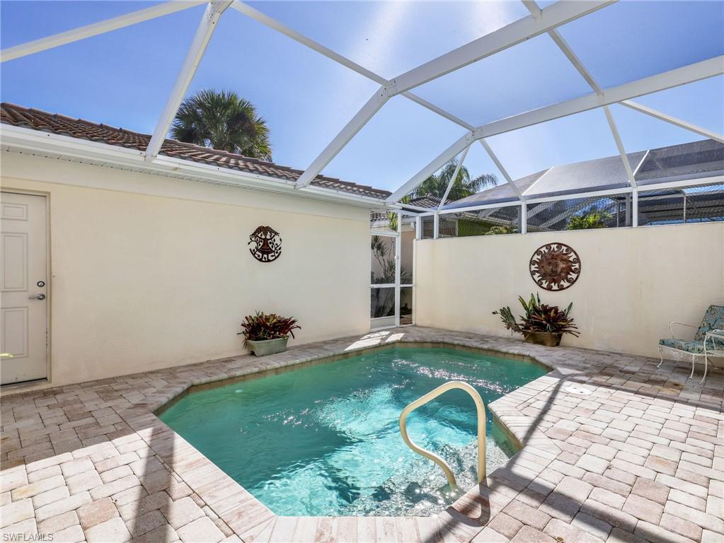 8192 Josefa Way Naples, FL 34114 - Photo 9 of 29 a room with lots of windows and potted plants